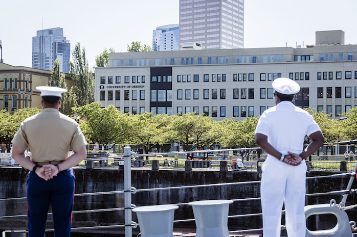 PORTLAND, OREGON (June 3, 2025) – U.S. Navy and Marines abord the Arleigh Burke-class guided missile destroyer USS Jack H. Lucas (DDG 125), man the rails of the USS Jack H. Lucas sailing in the Willamette River as it arrives for Portland Fleet Week during the 118th Rose Festival, June 3, 2025. Portland Fleet Week is a time-honored celebration of the sea services and provides an opportunity for the citizens of Oregon to meet Sailors, Marines, and Coast Guardsmen, as well as witness firsthand the latest capabilities of today’s maritime services. (U.S. Marine Corps photo by Cpl. Peyton Kahle)