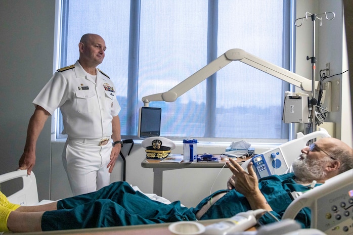 PORTLAND, OREGON (June 5, 2025) –Rear Adm. Christopher Nash, commander, Submarine Group 9, visits with a Navy veteran at the Portland VA Medical Center during Portland Fleet Week, June 5, 2025. Portland Fleet Week is a time-honored celebration of the sea services and provides an opportunity for the citizens of Oregon to meet Sailors, Marines, and Coast Guardsmen, as well as witness firsthand the latest capabilities of today’s maritime services. (U.S. Marine Corps photo by Sgt. Amelia Kang)