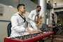 PORTLAND, OREGON (June 5, 2025) – U.S. Navy Musician 3rd class Dinos San Pedro, left, a native of California, and Musician 3rd class Jared Goodrum, a native of New Mexico, play music for veterans at the Portland VA Medical Center during Portland Fleet Week, June 5, 2025. Portland Fleet Week is a time-honored celebration of the sea services and provides an opportunity for the citizens of Oregon to meet Sailors, Marines, and Coast Guardsmen, as well as witness firsthand the latest capabilities of today’s maritime services. (U.S. Marine Corps photo by Sgt. Amelia Kang)