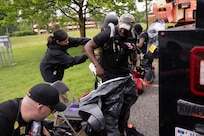 The 33rd Weapons of Mass Destruction Civil Support Team Survey Section don protective equipment for a full-scale chemical, biological, radiological, nuclear and explosive exercise at Joint Base Andrews, Md., May 21, 2025. In addition to career-field specific training requirements, each team member completed several hundred hours of position specific training.