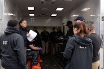 U.S. Army National Guard Staff Sgt. Maryann Marr, reconnaissance noncommissioned officer with the 33rd Weapons of Mass Destruction Civil Support Team, gives a pre-exercise brief for a full-scale chemical, biological, radiological, nuclear and explosive exercise at Joint Base Andrews, Md., May 21, 2025.  The exercise focused on identifying and mitigating an unknown CBRNE hazard.