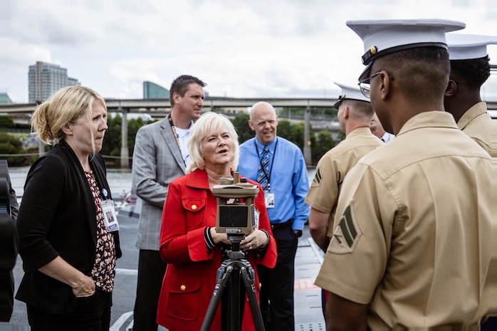 PORTLAND, OREGON (June 5, 2025) – U.S. Marines assigned to Battlespace Surveillance Company, 1st Intelligence Battalion, I Marine Expeditionary Force Information group, and a Vermont native, explains the roles of his military occupational specialty for Portland education members during Portland Fleet Week, June 5, 2025. Portland Fleet Week is a time-honored celebration of the sea services and provides an opportunity for the citizens of Oregon to meet Sailors, Marines, and Coast Guardsmen, as well as witness firsthand the latest capabilities of today’s maritime services. (U.S. Marine Corps photo by Cpl. Peyton Kahle)