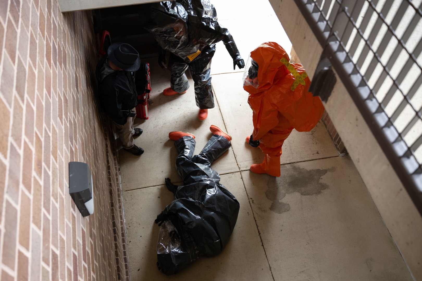 The 33rd Weapons of Mass Destruction Civil Support Team Survey Section simulate a man-down  during a full-scale chemical, biological, radiological, nuclear and explosive exercise at Joint Base Andrews, Md., May 21, 2025. The exercise tested the unit’s on-site assessment, hazard mitigation, communication setup, decontamination operations, safety measures, medical monitoring and coordination with local civilian agencies under the Incident Command System.