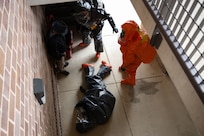The 33rd Weapons of Mass Destruction Civil Support Team Survey Section simulate a man-down  during a full-scale chemical, biological, radiological, nuclear and explosive exercise at Joint Base Andrews, Md., May 21, 2025. The exercise tested the unit’s on-site assessment, hazard mitigation, communication setup, decontamination operations, safety measures, medical monitoring and coordination with local civilian agencies under the Incident Command System.