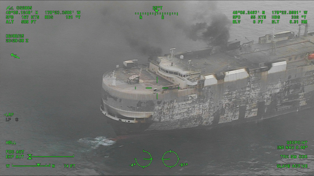 A Coast Guard C-130J Super Hercules aircrew from Coast Guard Air Station Kodiak conducts an overflight of a fire aboard the cargo vessel Morning Midas approximately 260 miles southwest of Adak, June 8, 2025. The Coast Guard is in close communication with Zodiac Maritime, the manager of the Morning Midas, as they develop their salvage and safety plans with Resolve Marine. (U.S. Coast Guard photo courtesy of Air Station Kodiak)