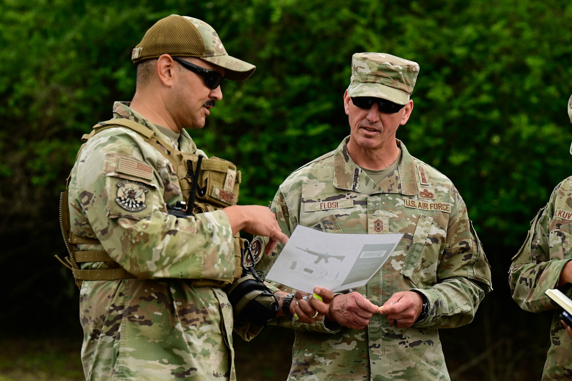 Military personnel have a conversation.