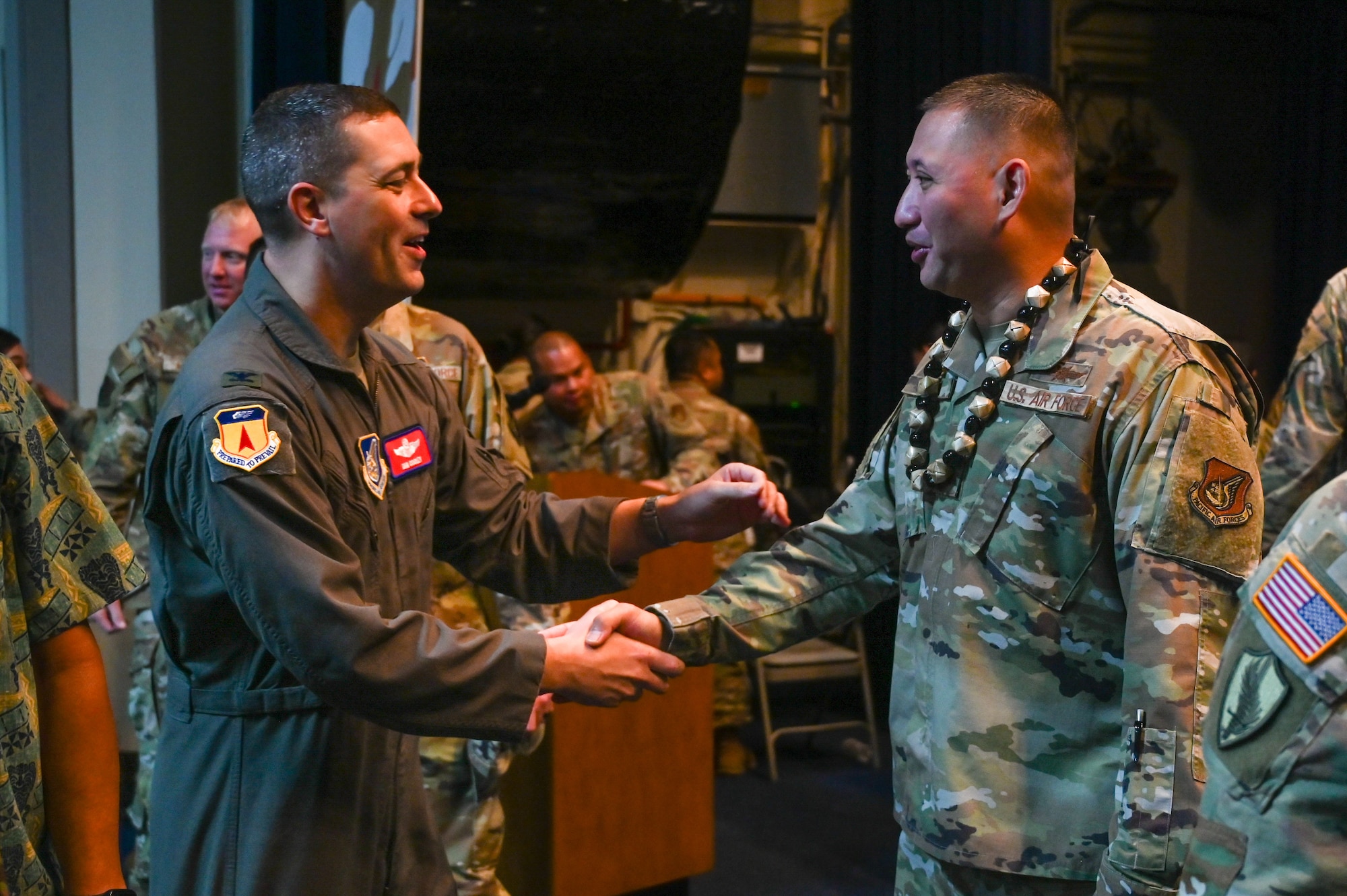 U.S. Air Force Col. Charles Cooley, 36th Wing commander, Andersen Air Force Base, Guam, congratulates Capt. Tommy Joe Rivera, 254th Communications Flight (CF) commander, Guam Air National Guard, during a ceremony on Andersen AFB, Guam, June 7, 2025.