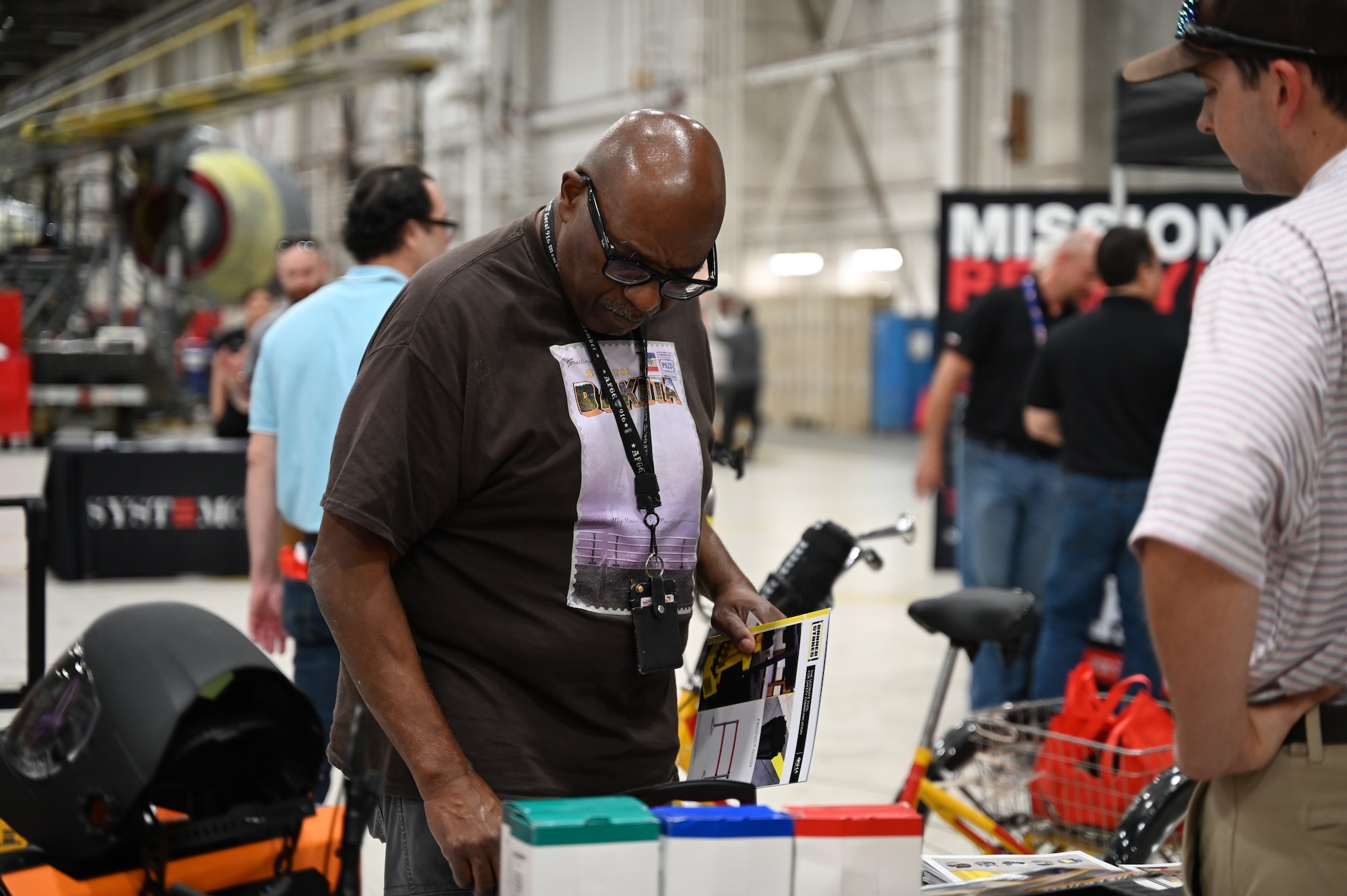 Person at booth looking at information.