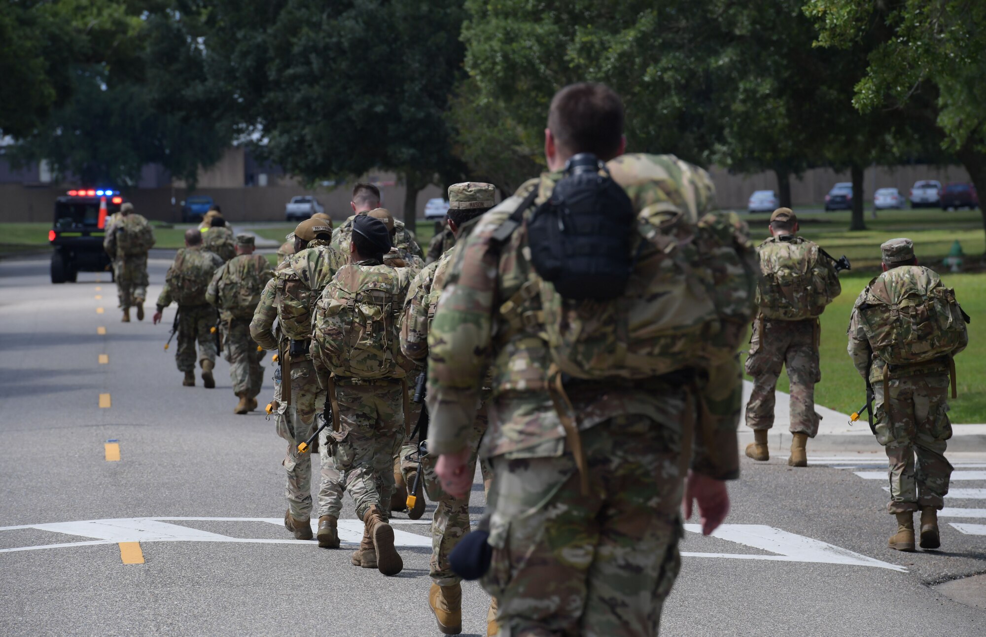 Service members ruck around base during Warrior Day