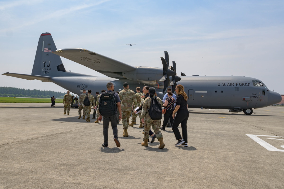 U.S. Air Force Language Enabled Airman Program scholars are briefed by Airmen from the 374th Maintenance Squadron during a three-week integration at Yokota Air Base, Japan, May 15, 2025. The scholars, fluent in multiple languages with an emphasis on Japanese, participated in immersion training designed to increase their understanding of the unique challenges Yokota faces when coordinating with allied and partner nations.