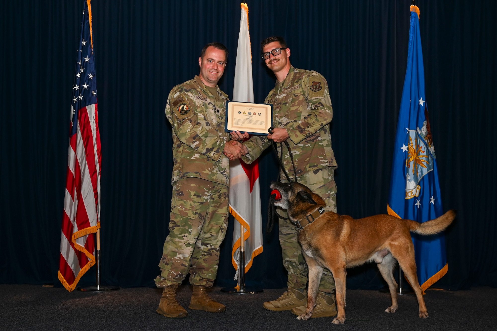 MWD Edy is presented a certificate.