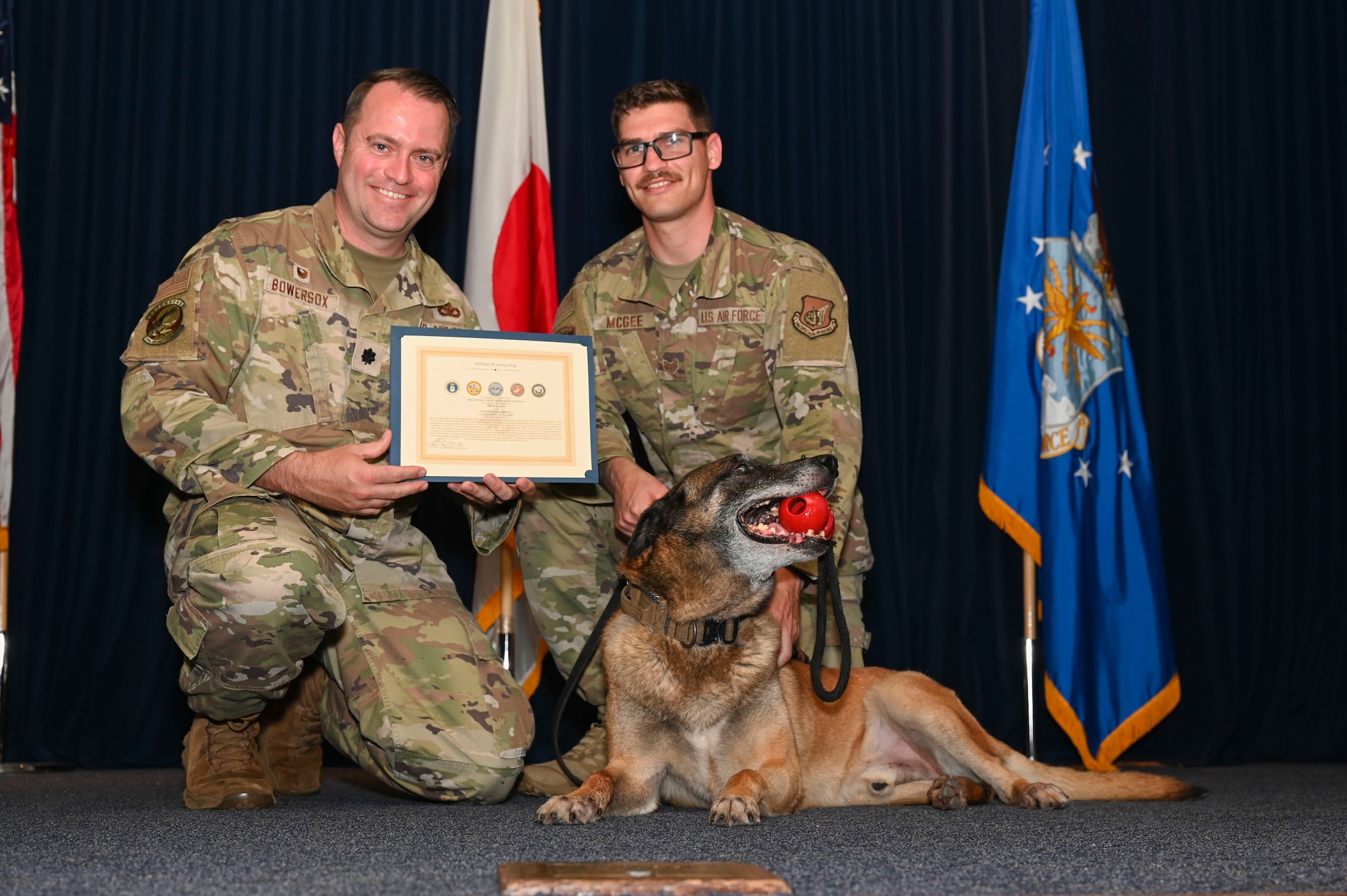 MWD Edy is presented a cerificate.