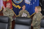 Defense Logistics Agency Director Army Lt. Gen. Mark Simerly, left, greets U.S. Army Materiel Command Chief of Operations Brig. Gen. Gail Atkins, center, and Army Deputy Chief of Staff for Logistics Lt. Gen. Heidi Hoyle, right, during the Army/DLA Service Integration Day