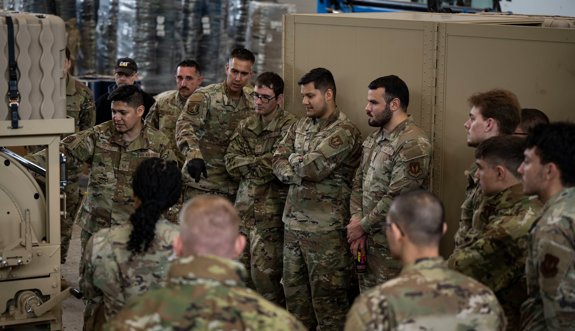 U.S. Airmen from the 100th Civil Engineer Squadron listen to instruction on the trailer cable spool during expeditionary airfield lighting system training at RAF Feltwell, England, June 6, 2025.