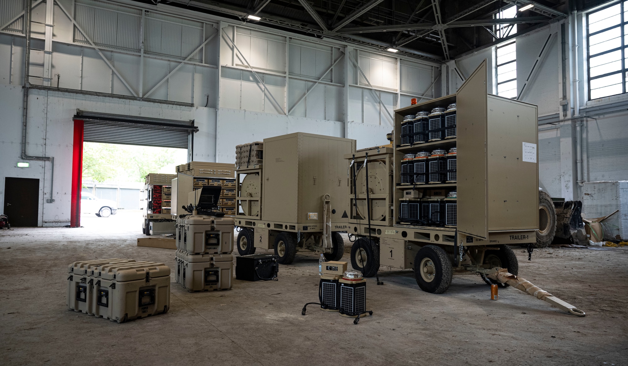A U.S. Air Force expeditionary airfield lighting system belonging to the 100th Civil Engineer Squadron rests inside a hangar at RAF Feltwell, England, June 6, 2025.