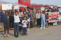 Families greet and celebrate the Arleigh Burke-class guided-missile destroyer USS Oscar Austin’s (DDG 79) return to Naval Station Rota, Spain, June 10, 2025.