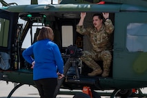 A 54th Helicopter Squadron (HS) UH-1N Iroquois flight engineer briefs a member of the city of Minot community on the helicopter's capabilities during a Military Affairs Committee luncheon at Minot Air Force Base, North Dakota, June 5, 2025. The 54th HS provides the 91st Missile Wing rapid security response capabilities to Team Minot’s missile fields, providing overwatch security during convoy operations, as well as executing search and rescue and medical evacuation operations. (U.S. Air Force photo by Senior Airman Alex Nottingham)