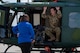 A 54th Helicopter Squadron (HS) UH-1N Iroquois flight engineer briefs a member of the city of Minot community on the helicopter's capabilities during a Military Affairs Committee luncheon at Minot Air Force Base, North Dakota, June 5, 2025. The 54th HS provides the 91st Missile Wing rapid security response capabilities to Team Minot’s missile fields, providing overwatch security during convoy operations, as well as executing search and rescue and medical evacuation operations. (U.S. Air Force photo by Senior Airman Alex Nottingham)