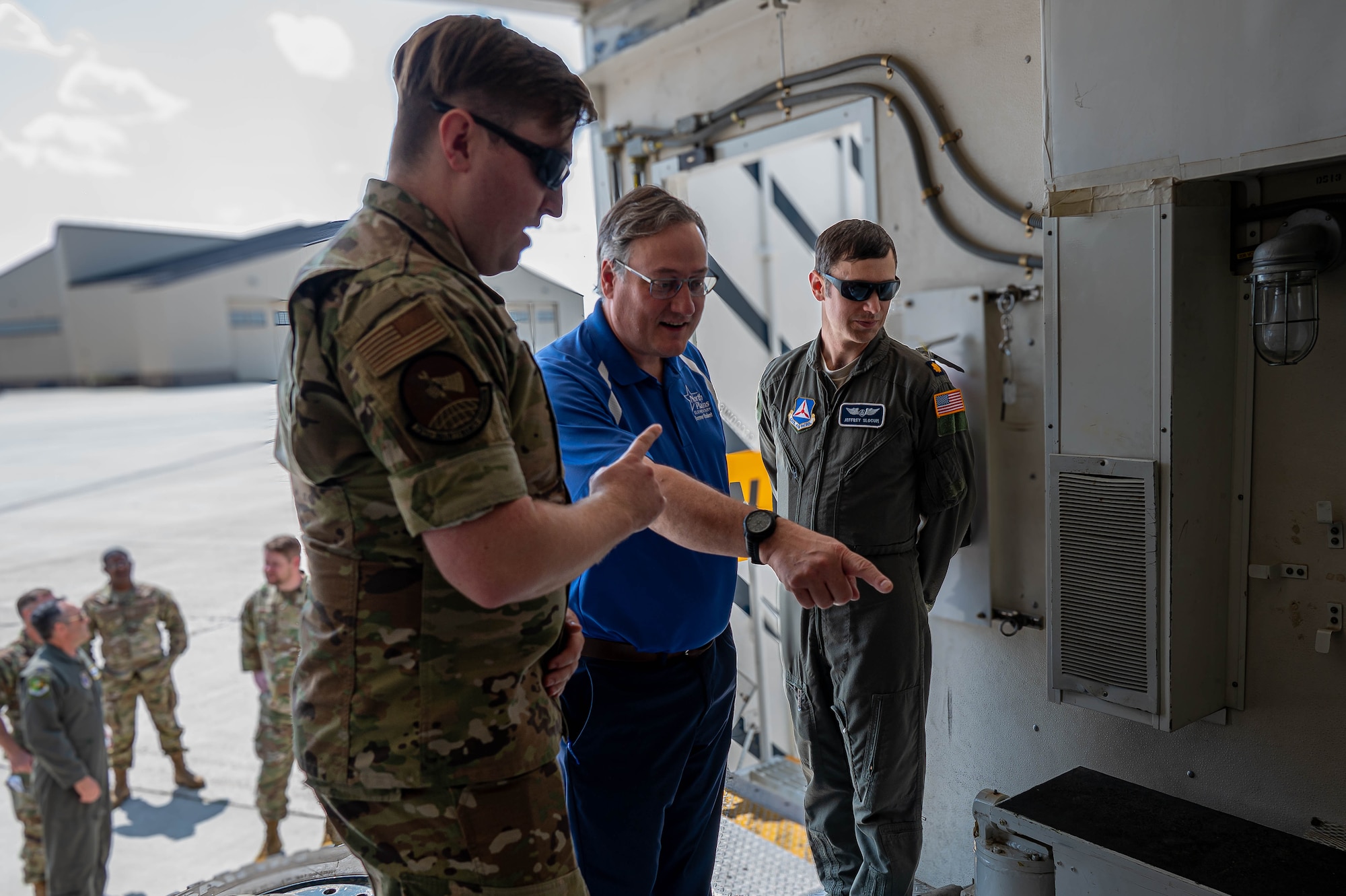 A 91st Missile Maintenance Airman briefs Tom Rafferty, Military Affairs Committee chairman, on the payload transporter vehicle during a Military Affairs Committee luncheon at Minot Air Force Base, North Dakota, June 5, 2025. These vital vehicles are responsible for transporting the Minuteman III intercontinental ballistic missile across vast distances, utilizing public roads to reach strategic locations, and ensuring precise emplacement or removal at launch facilities. (U.S. Air Force photo by Senior Airman Alex Nottingham)