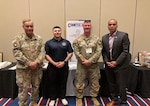 Chief Warrant Officer Four Bill Elliott, Tribal Liaison with the Washington Military Department, Sgt. Isaiah Salgado, Sgt. 1st Class Scott Salmon, Washington National Guard Counterdrug Program members pose for a photo with Washington Attorney General Nick Brown at Tribal Opioid/Fentanyl Summit, May 22, 2025 at the Cowlitz Tribe’s reservation in Ridgefield, Wash.
