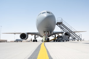 A KC-46A Pegasus assigned to the 32nd Expeditionary Air Refueling Squadron undergoes preflight checks on a flightline within the U.S. Central Command area of responsibility, June 5, 2025. The KC-46A Pegasus has three primary refueling points and is capable of refueling two receiver aircraft simultaneously. (U.S. Air Force photo by Senior Airman Dieondiere Jefferies)