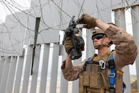 Marines securing concertina wire