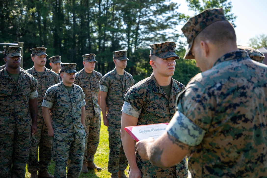 U.S. Marine Corps Sgt. Nicky Estupinan, a native of Calgary, Alberta, Canada, and a satellite communications operator with the 24th Marine Expeditionary Unit (MEU), reenlists at Marine Corps Base Camp Lejeune, North Carolina, May 14, 2025. The reenlistment ceremony serves to highlight Marines who continue their service, and it reaffirms the core values of honor, courage, and commitment to the Corps and to the nation. (U.S. Marine Corps photo by Cpl. Daniel Childs)