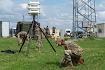 Airmen assigned to the 155th Air Refueling Wing secure a Blue Sky Mast System at the Nebraska National Guard air base in Lincoln, Nebraska, June 6, 2025. The Airmen were participating in a three-day Combat Readiness Exercise which evaluates the wing's ability to rapidly mobilize, deploy and sustain operations in a simulated contingency environment.