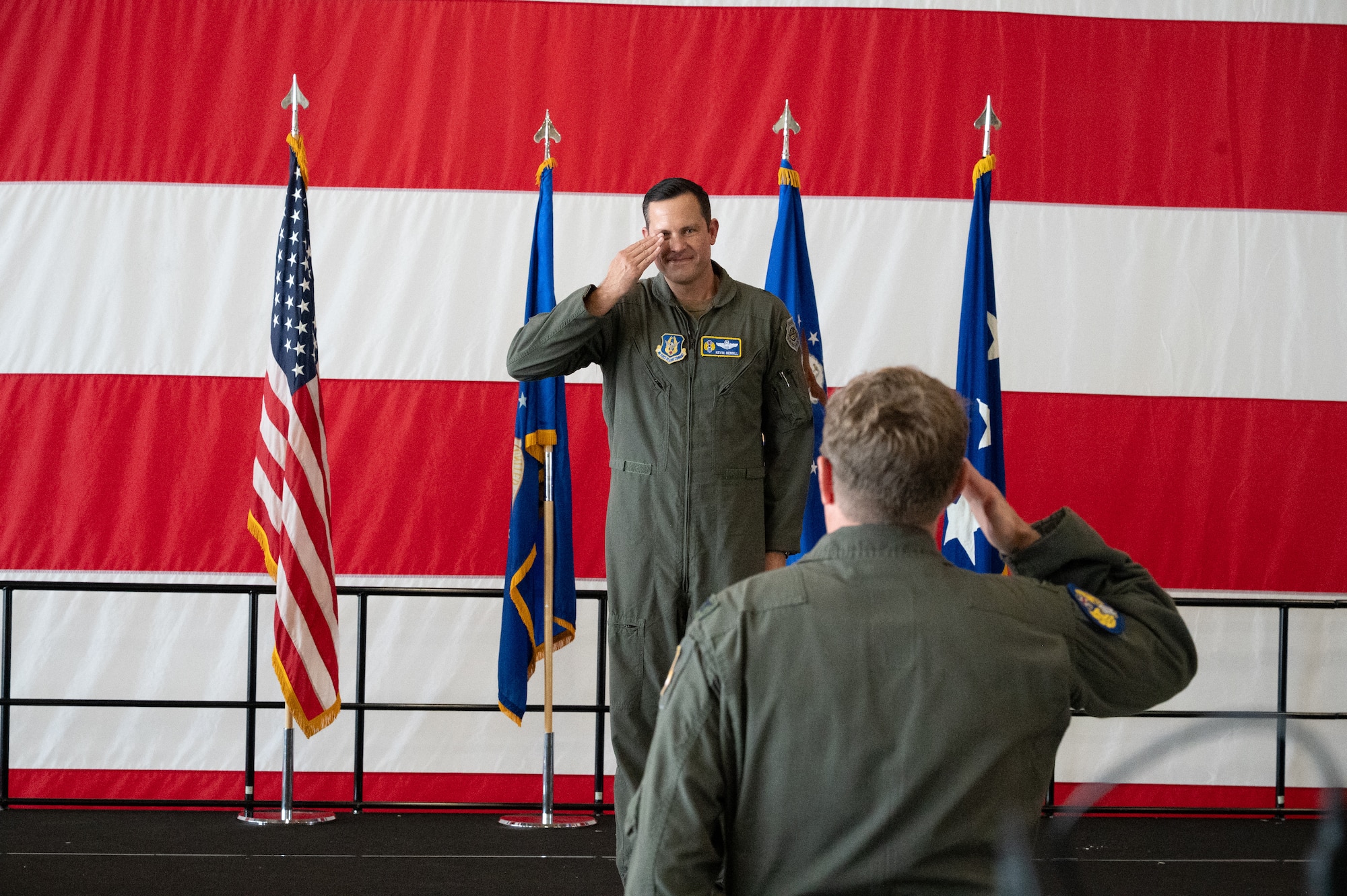 Col. Charles Huber, 10th Air Force Deputy Director of Operations and Plans, renders the customary first salute to Brig. Gen. Kevin Merrill during the 10th Air Force change of command ceremony at Naval Air Station Joint Reserve Base Fort Worth, Texas, June 8, 2025.