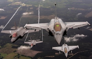 Two U.S. Air Force F-35A Lightning IIs assigned to the 4th Fighter Squadron, Hill Air Force Base, Utah, and two Dassault Rafales assigned to the 1/4 Gascogne Fighter Squadron, 113 Saint-Dizier-Robinson air base, France, break formation during flight May 18, 2021 over France. The flight was a part of the Atlantic Trident 21 exercise which is a joint, multinational exercise involving service members from the U.S., France and the U.K., and is aimed at enhancing fourth and fifth generation integration, combat readiness and fighting capabilities, through conducting complex air operations in a contested multinational joint force environment.