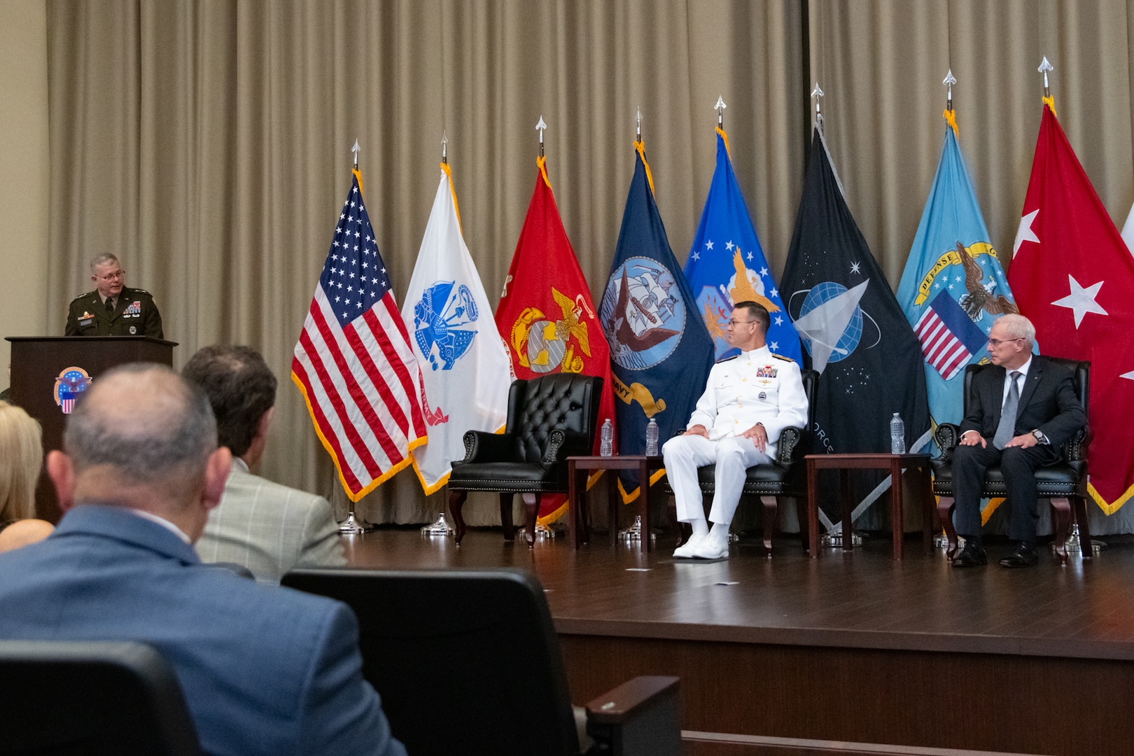 Personnel taking part in a relinquishment ceremony.