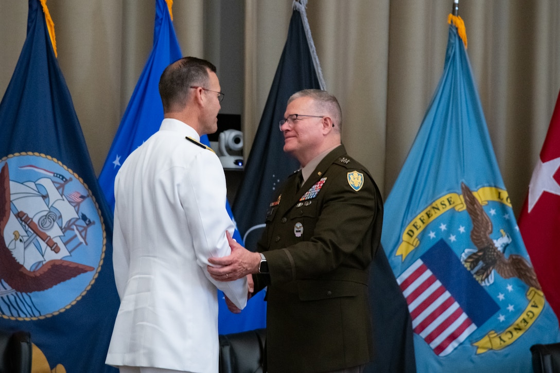 Personnel taking part in a relinquishment ceremony.