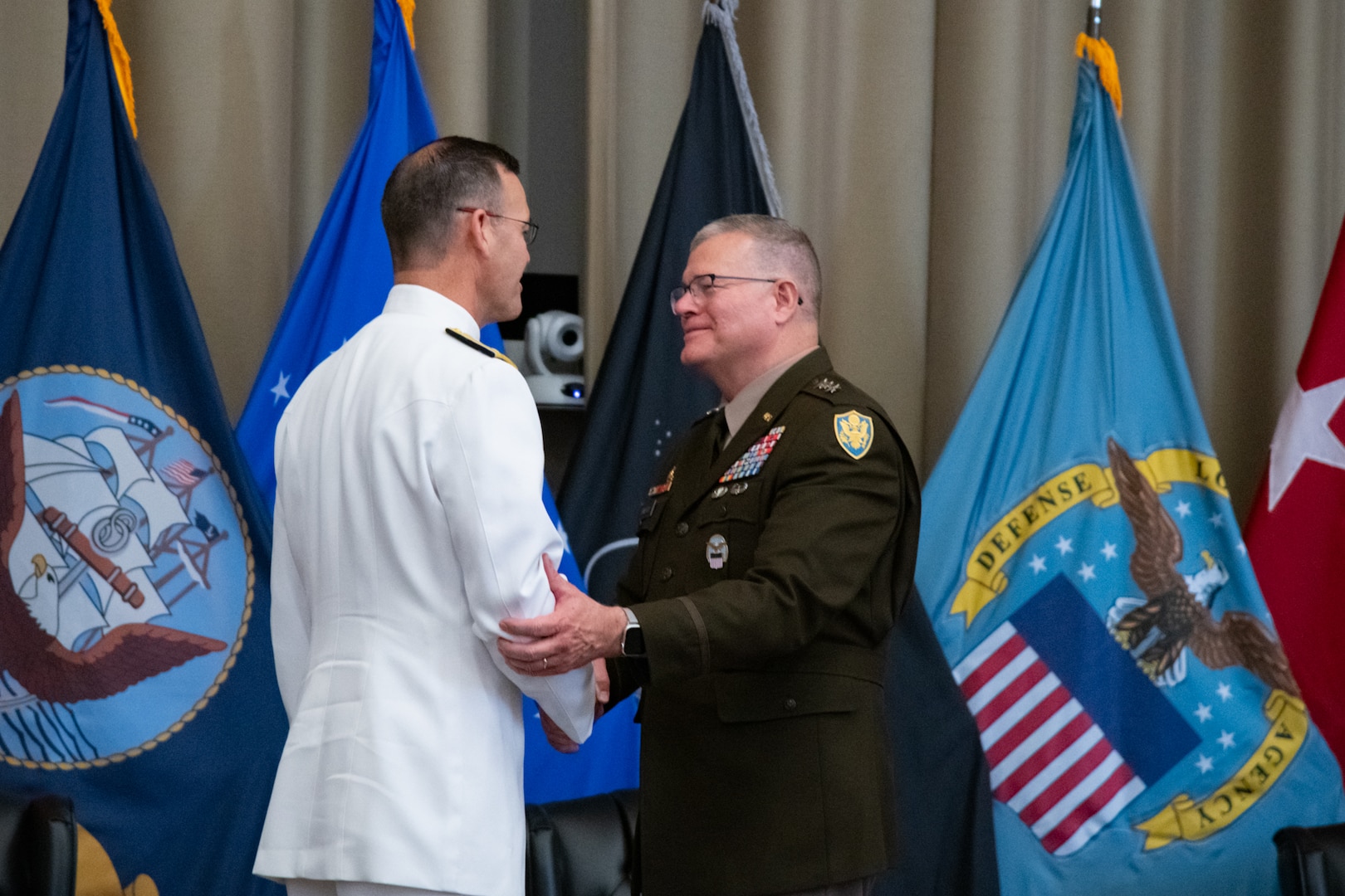 Personnel taking part in a relinquishment ceremony.