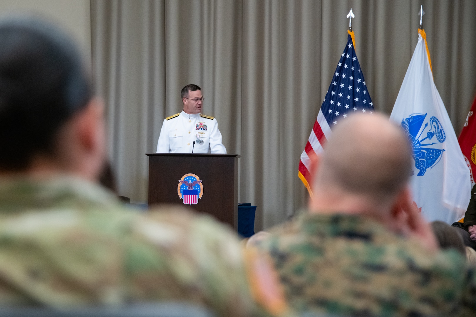 Personnel taking part in a relinquishment ceremony.