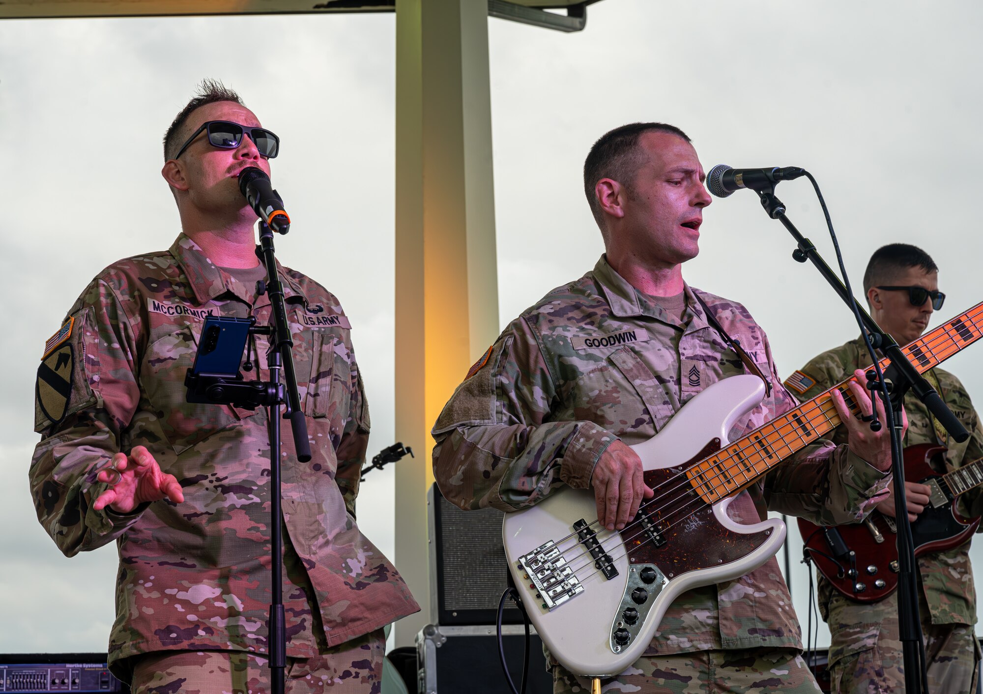 U.S. Army Staff Sgt. Jeffery McCormick, lead vocalist, left, and Master Sgt. Tyler Goodwin, bass guitarist perform.