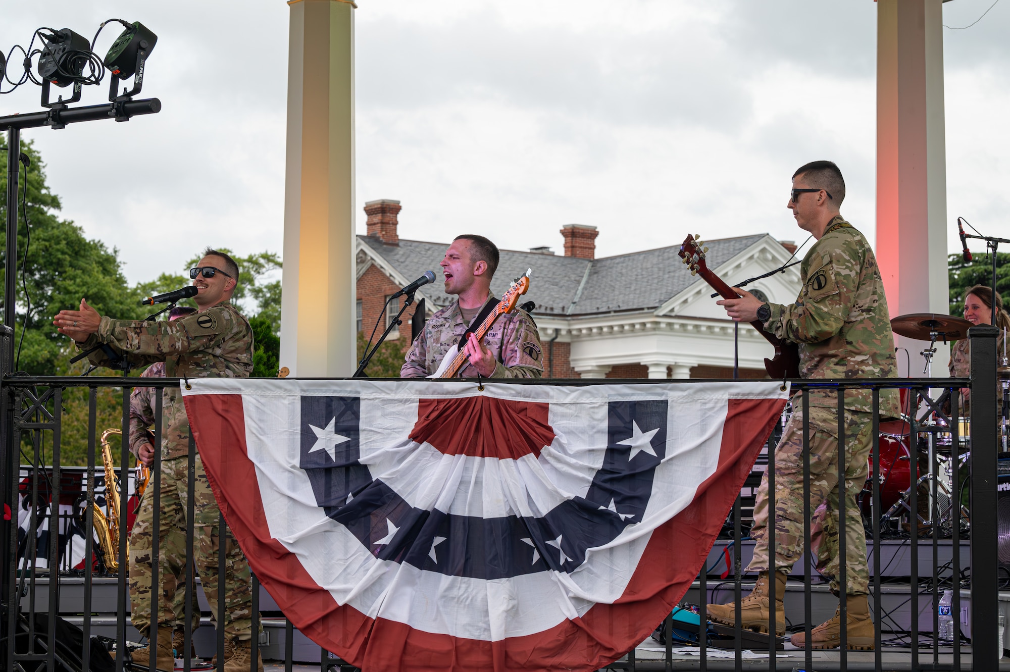 The U.S. Army Training Doctrine and Command Rock Band performs.