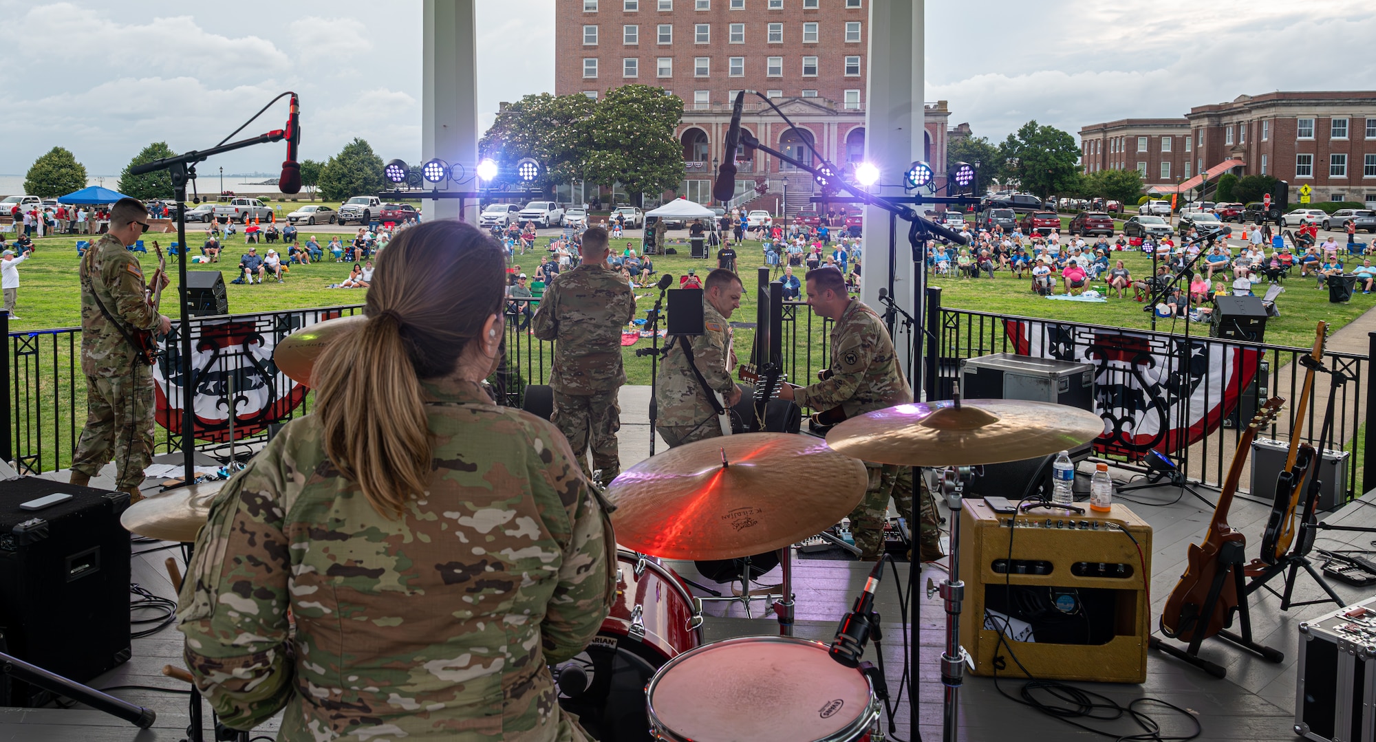 The U.S. Army Training Doctrine and Command Rock Band performs.