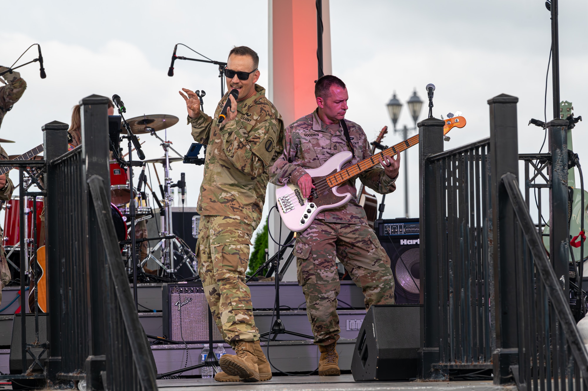U.S. Army Staff Sgt. Jeffery McCormick, lead vocalist, left, and Master Sgt. Tyler Goodwin, bass guitarist perform.