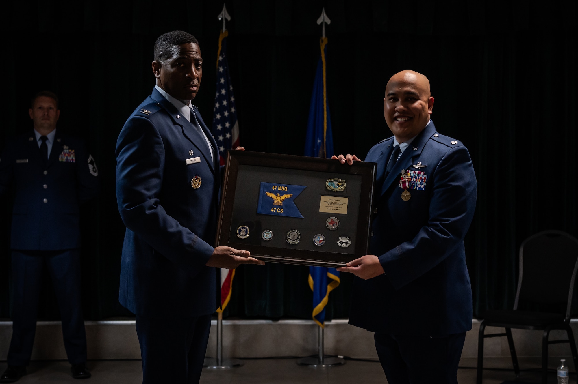 Airmen from the 47th Communications Squadron (CS) gathered at XL Landings to witness a transition of leadership as Lt. Col. Elmer Lustina relinquished command to Maj. Anthony Dimuzio during a change of command ceremony, June 9, 2025.