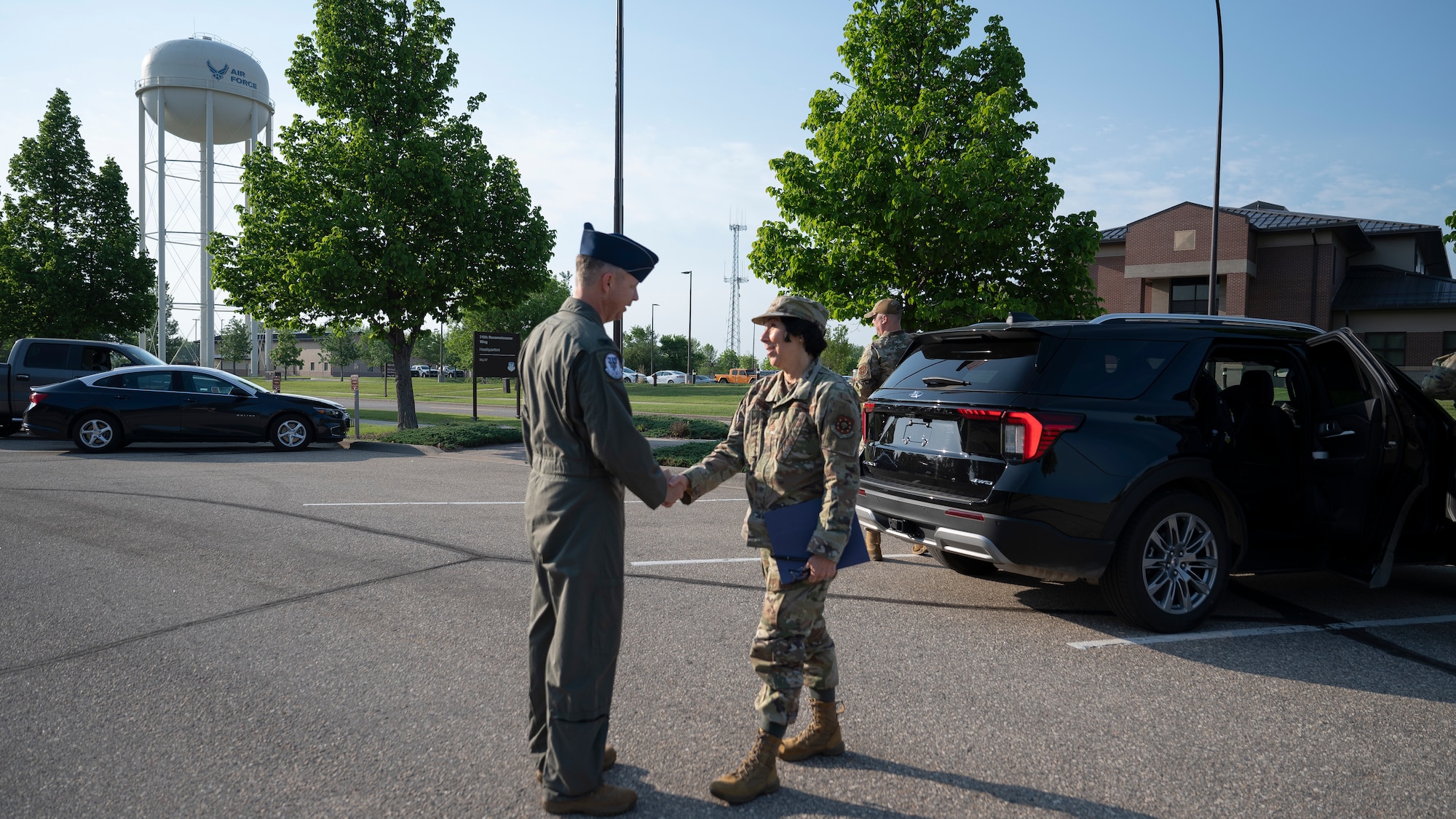 Maj. Gen. Jeannine Ryder, Air Force Medical Readiness Command-Bravo commander, shakes hands with Col. Timothy Monroe, 319th Reconnaissance Wing commander, at Grand Forks Air Force Base, N.D., June 3, 2025.