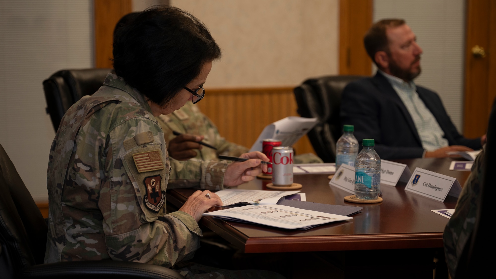 Maj. Gen. Jeannine Ryder, Air Force Medical Readiness Command-Bravo commander, writes notes during a briefing by the 319th Medical Group at Grand Forks Air Force Base, N.D., June 3, 2025.