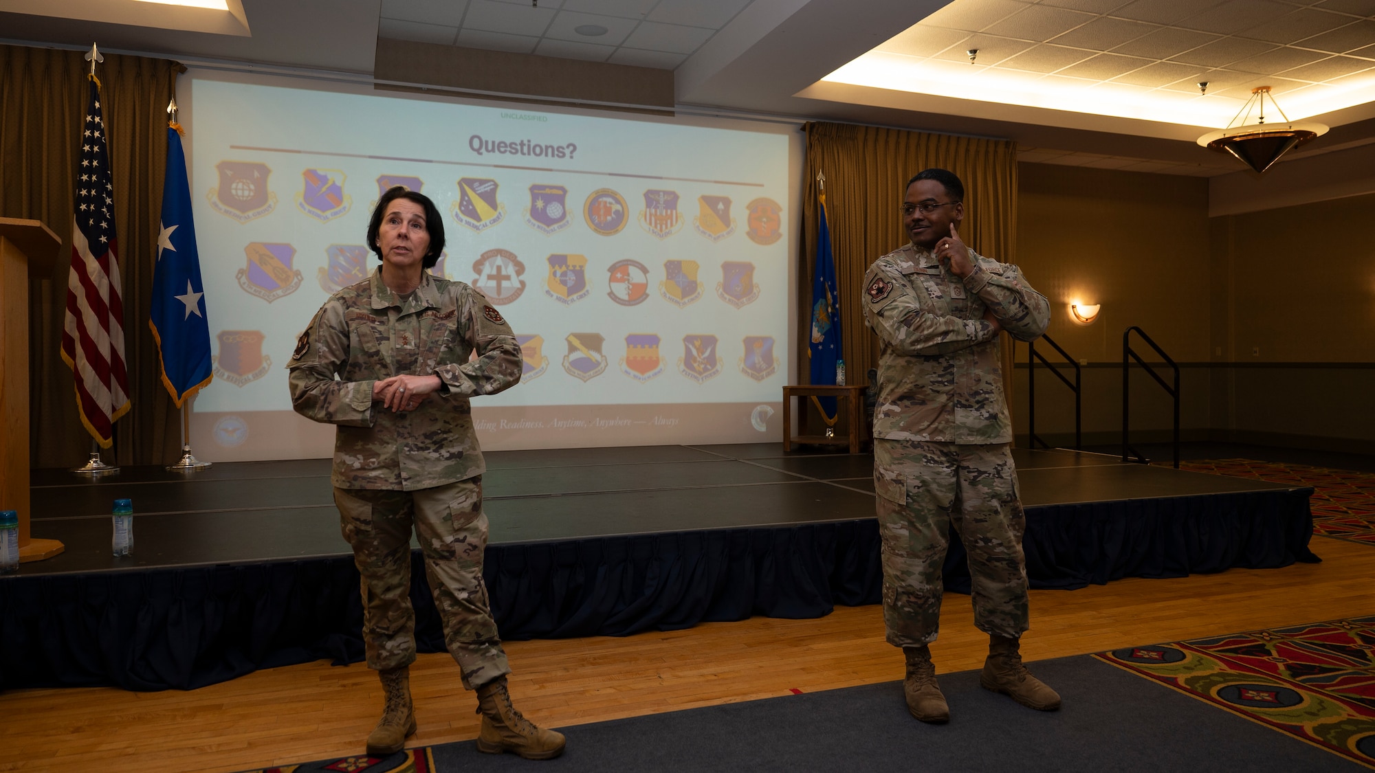 Maj. Gen. Jeannine Ryder, Air Force Medical Readiness Command-Bravo commander and CMSgt Jerry Dunn, Medical Readiness Command-Bravo command chief, listen to questions at a town hall briefing for airmen assigned to the 319th Medical Group at Grand Forks Air Force Base, N.D., June 3, 2025.