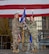 U.S. Air Force Col. Jesse Lamarand, 5th Bomb Wing commander, presents Col.. Tiffany Arnold, 5th Maintenance Group (5MXG) commander, the guidon during the 5MXG change of command ceremony at Minot Air Force Base, North Dakota, June 4, 2025. The passing of the guidon represents Arnold’s assumption of command of the 5MXG. (U.S. Air Force photo by Senior Airman Alex Nottingham)