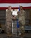 U.S. Air Force Col. Jesse Lamarand, 5th Bomb Wing commander, presents Col. Rofelio Grinston, 5th Maintenance Group (5MXG) commander, the meritorious service medal during the 5MXG change of command ceremony at Minot Air Force Base, North Dakota, June 4, 2025. During the ceremony, Grinston relinquished command to Col. Jesse Lamarand. (U.S. Air Force photo by Senior Airman Alex Nottingham)