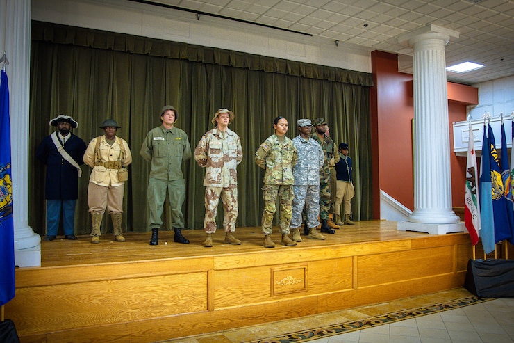 Soldiers display Army historical uniforms during an Army Heritage Month Celebration June 6, 2025.
