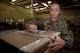 Airman 1st Class Emily Leavitt, Traffic Management Office inbound cargo technician, opens a piece of cargo at Minot Air Force Base, North Dakota, Jun 3, 2025. Every box is opened and inspected to count the quantity of cargo inside. (U.S. Air Force Senior Airmen Alex Nottingham)