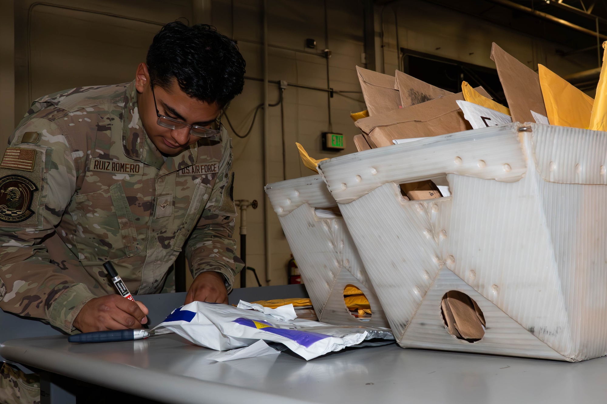 Airman Joseph Romero, Traffic Management Office(TMO) inbound cargo technician, confirms an invoice at Minot Air Force Base, North Dakota, Jun 3, 2025. The TMO manages and safeguards supplies and goods essential to Team Minot’s mission. (U.S. Air Force Senior Airmen Alex Nottingham)