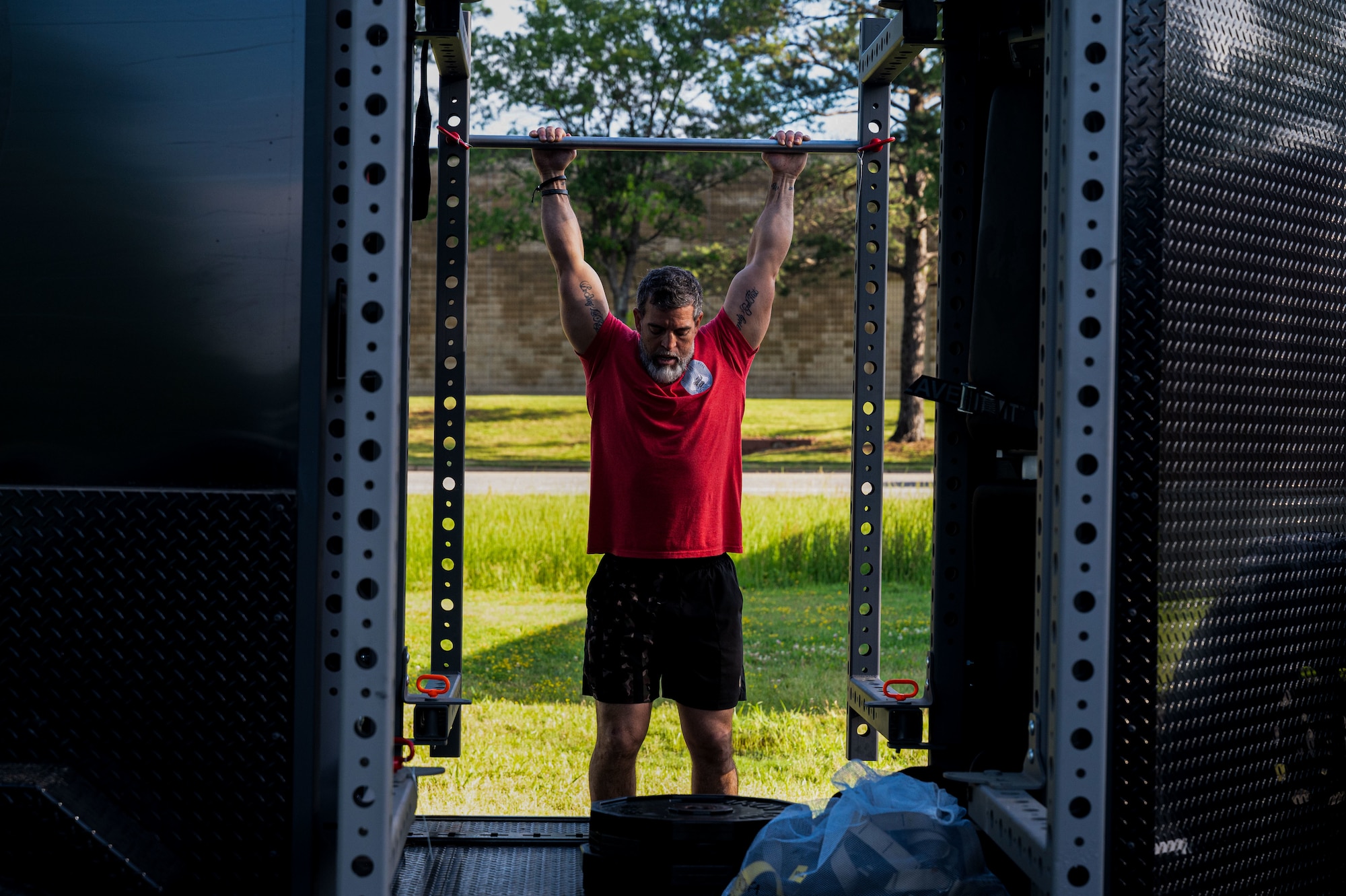 Man does pull-up.