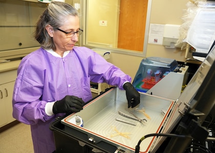 JOINT BASE SAN ANTONIO-FORT SAM HOUSTON – (June 5, 2025) – Tarea Burton, of Lexington, Ky., a research scientist assigned to Naval Medical Research Unit (NAMRU) San Antonio’s Combat Casualty Care and Operational Medicine directorate, utilizes the third generation of the Rugged Ozone Sterilization System Model M1 (ROSS M1) to sterilize medical instruments at the Battlefield Health and Trauma Research Institute.  The ROSS M1) is a portable unit that generates ozone and vaporized hydrogen peroxide for the on-demand sterilization of a variety of medical instruments. Partnering with SteriO3 since 2021, the ROSS M1 will enable combat medics, corpsmen, dentists and surgical personnel to sterilize instruments needed for dentistry and surgery, utilizing a process that would sanitize the medical instruments within an hour.  Burton, who earned her Master of Science in Biology from the University of Texas Health Science Center at San Antonio in 2019, has been supporting NAMRU San Antonio for 11 years. Navy Medicine Research & Development (NMR&D) employs highly qualified medical researchers and works alongside a wide range of research and development partners to keep abreast of best practices and advances in medical knowledge on behalf of Navy Medicine to increase warfighter lethality. NAMRU San Antonio, part of NMR&D, conducts gap-driven combat casualty care, craniofacial, and directed energy research in support of Navy, Marine Corps and joint U.S. warfighter health readiness and lethality while engaged in routine and expeditionary operations. (U.S. Navy Photo by Burrell Parmer, NAMRU San Antonio Public Affairs/Released)