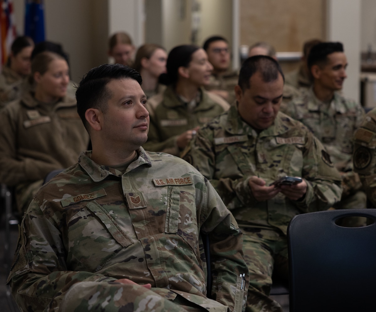 U.S. Air National Guard Tech. Sgt. Juan Gomez, a Health Administration Services specialist with the 162nd Medical Group, listens during a welcome briefing at Joint Base Elmendorf-Richardson as part of Medical Facilities Annual Training, June 9, 2025. MFAT fosters interoperability between Air National Guard and active duty medical personnel, strengthening coordination and readiness across the total force. (U.S. Air National Guard photo by Staff Sgt. Guadalupe Beltran)
